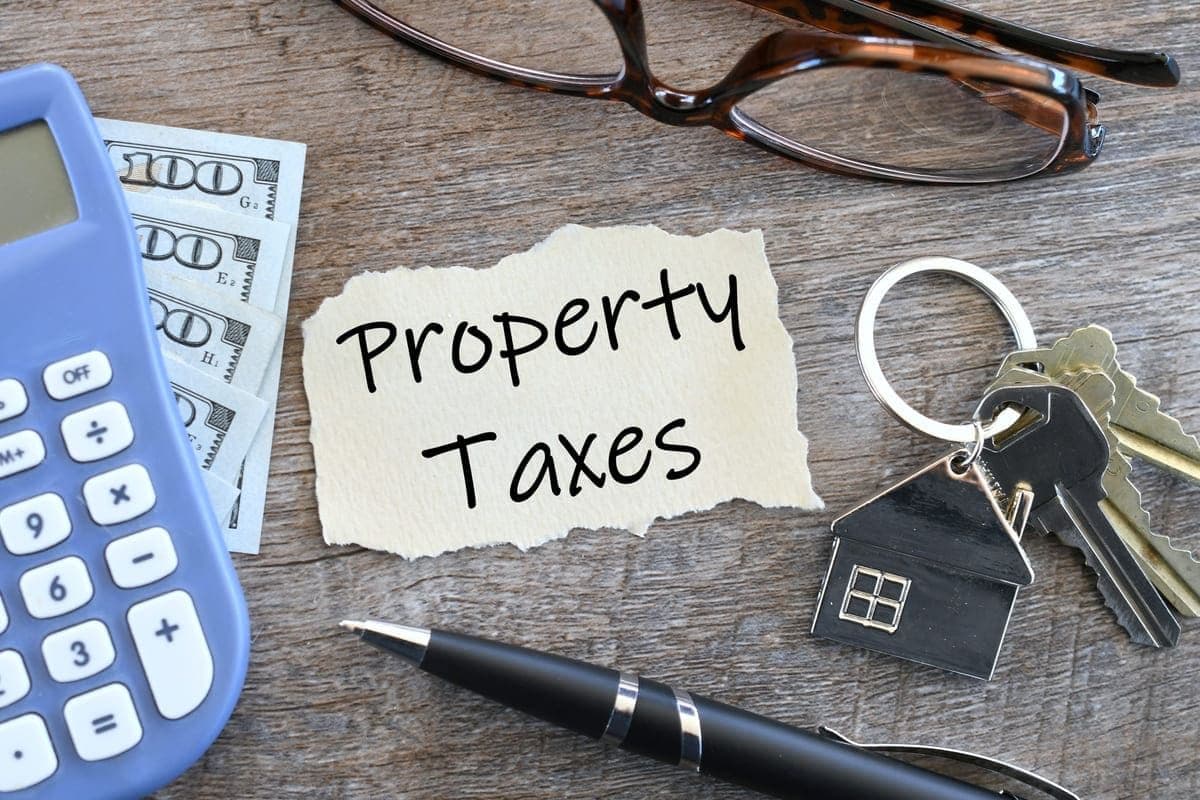 Property Taxes Concept with Calculator, Money and Keys