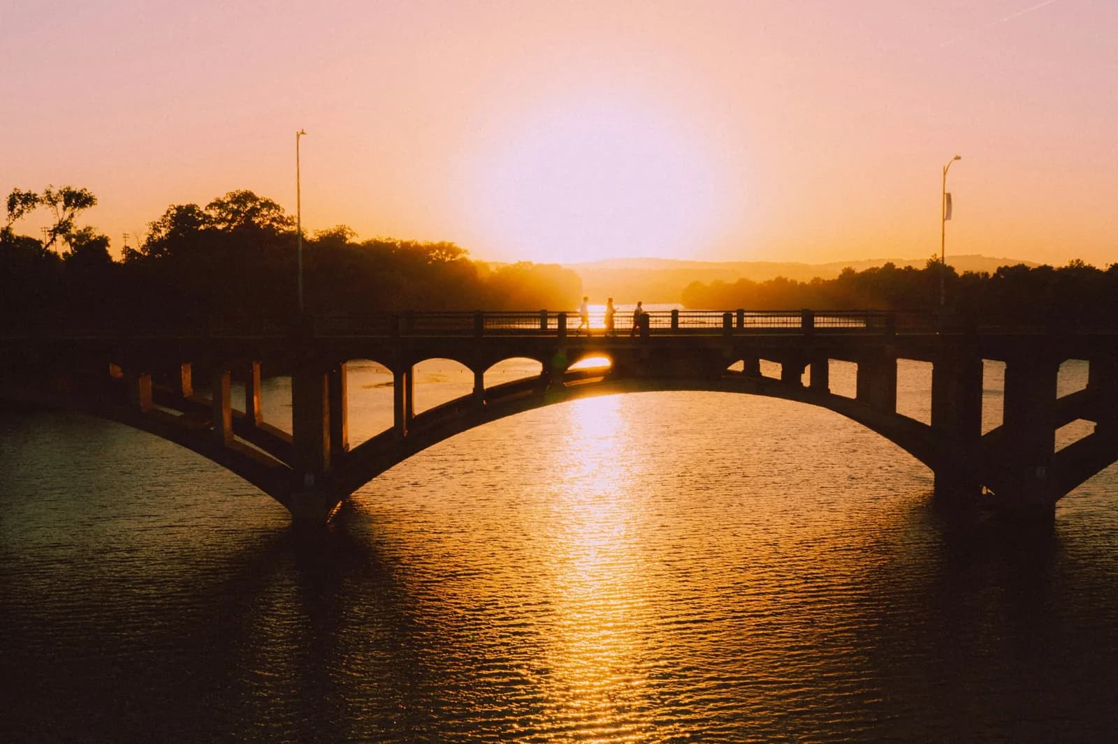 Sunset over a bridge and the water in Austin